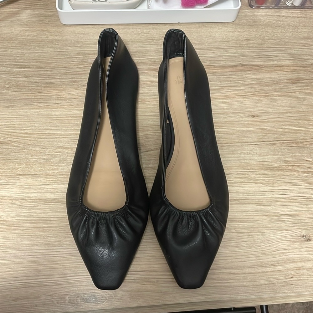 Black leather flats